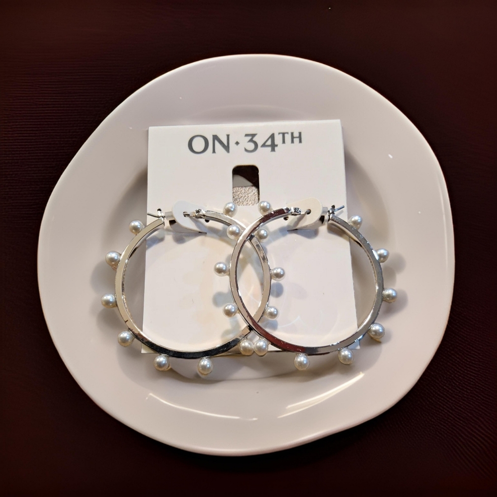 On 34th silver hoop earrings
